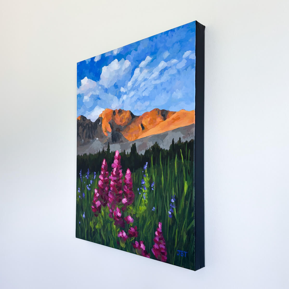 painting featuring mountains and wildflowers