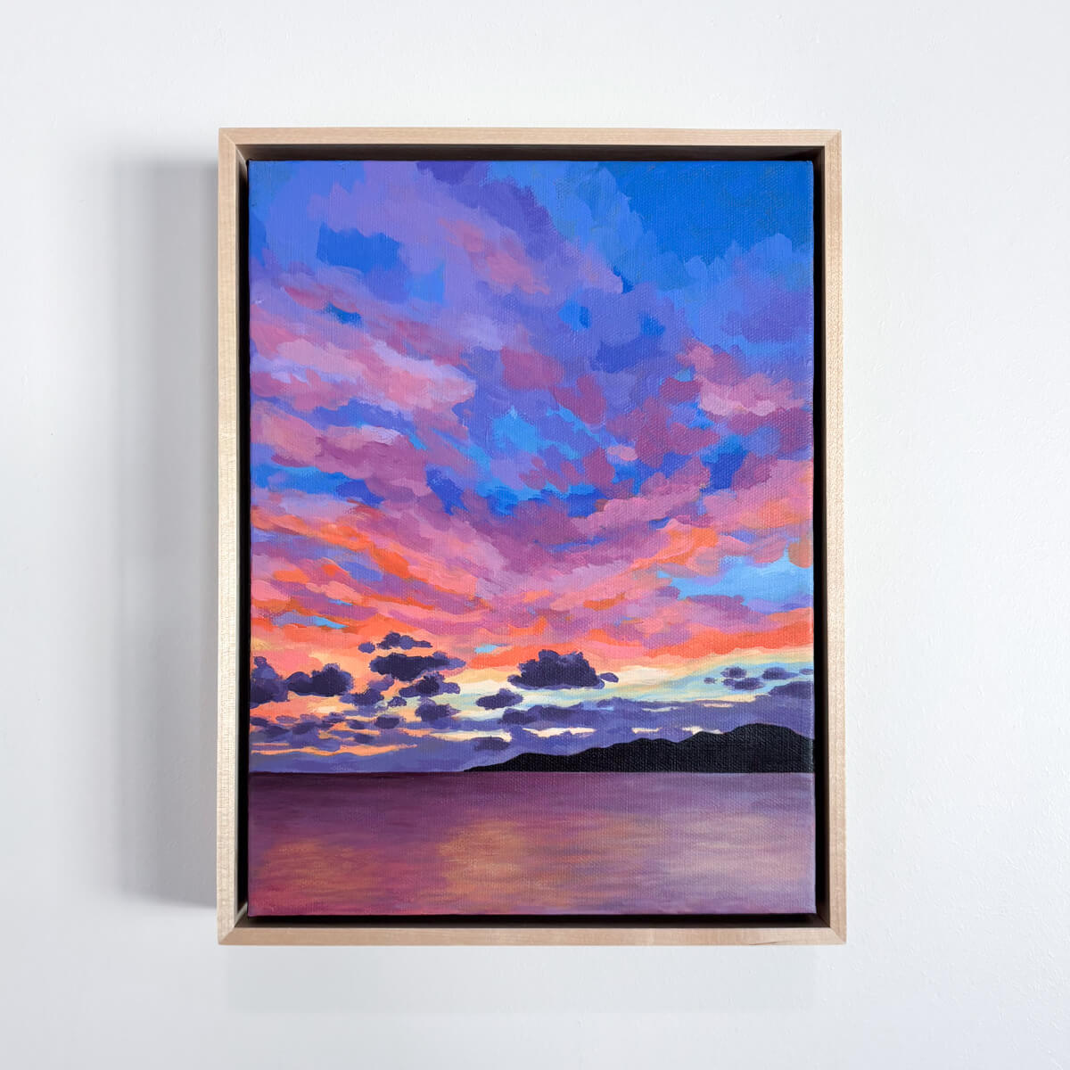 painting featuring a colorful sunset reflected in a calm ocean