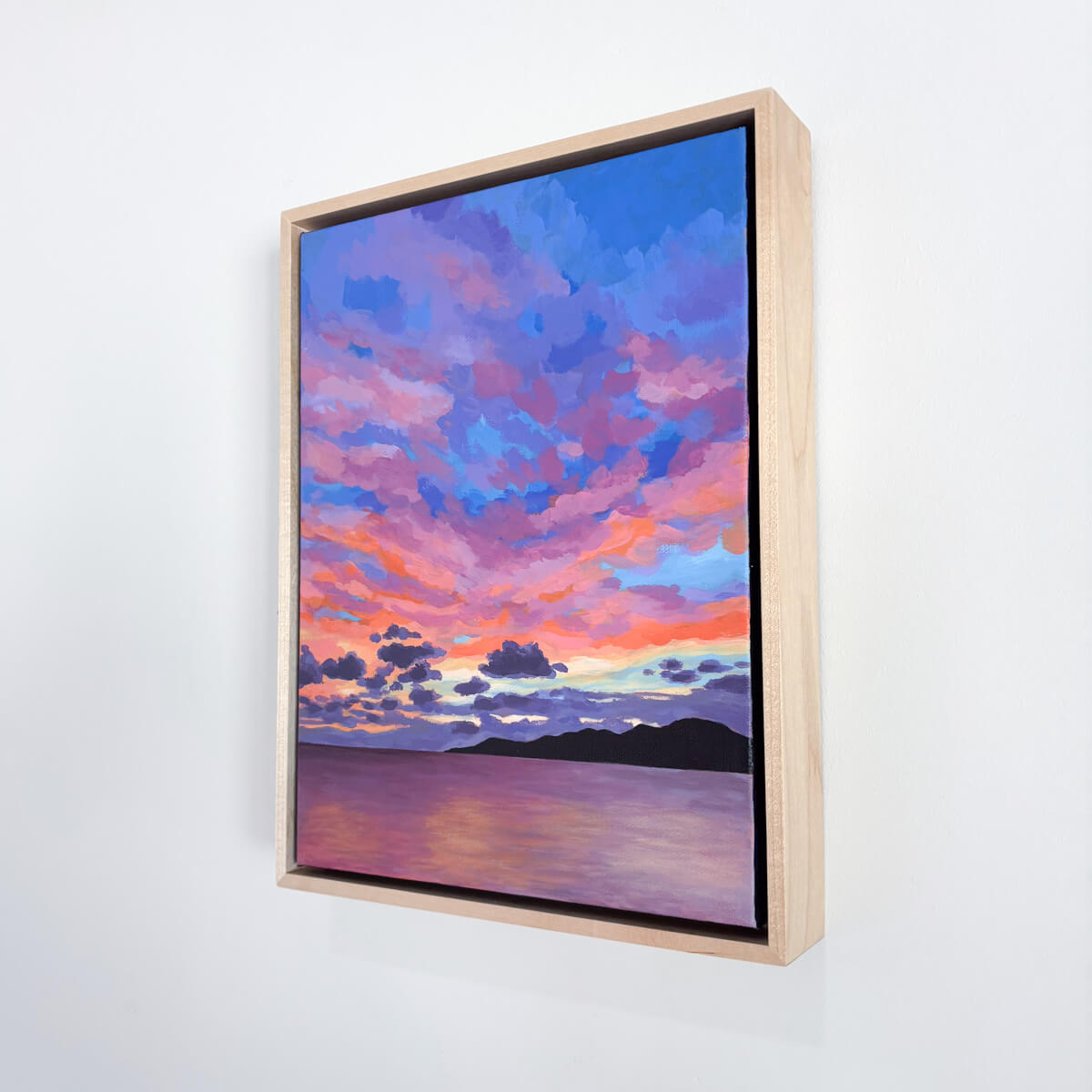 painting featuring a colorful sunset reflected in a calm ocean