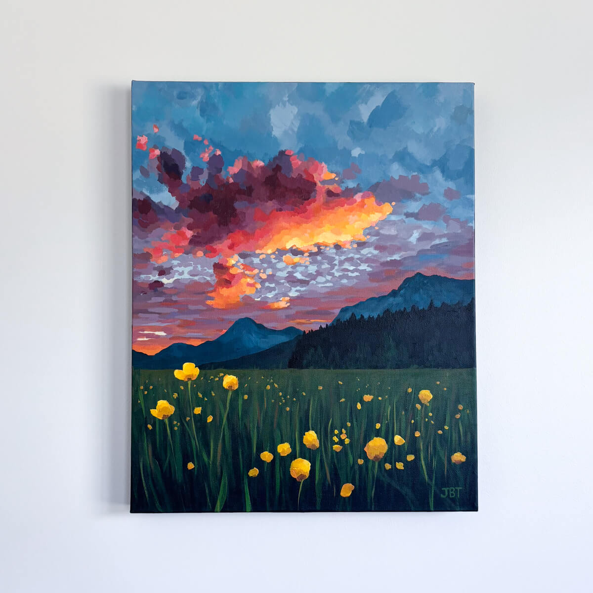 painting featuring colorful clouds, mountains, and yellow flowers